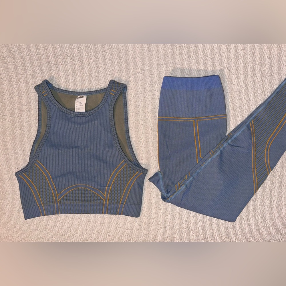 Fabletics seamless low impact open back bra high waisted compressive leggings.